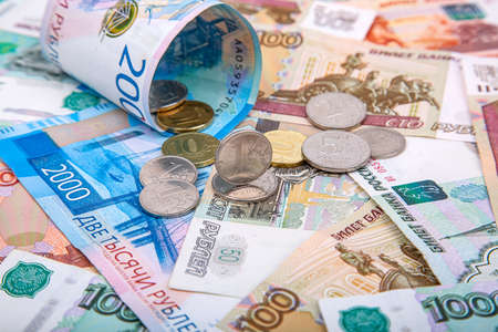 Background of Russian rubles, banknotes and coins close-up