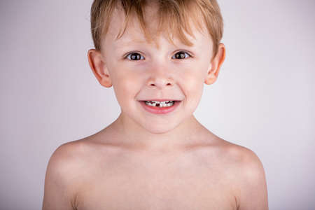 Loss of the first baby tooth in a childの写真素材
