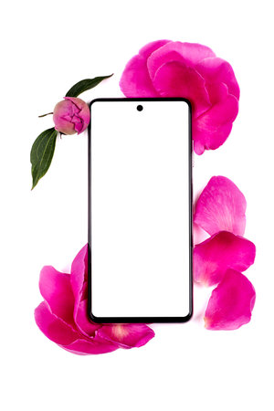 The phone is in pink flowers and peony petals on a white background. Mock-upの写真素材