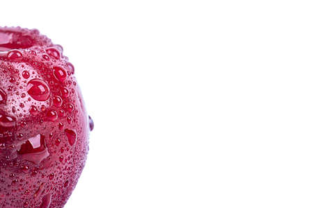 ripe cherry in drops of water, on a white background, macro photographyの写真素材