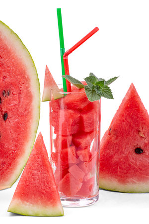 Watermelon cocktail with mint and watermelon slices, isolated on a white background, close-upの写真素材