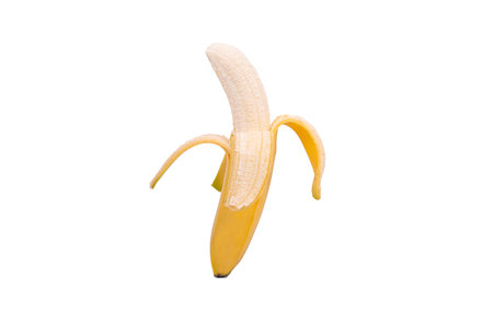 Yellow, half-peeled banana, isolated on a white backgroundの写真素材