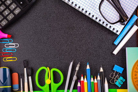 Soon to school, stationery on the background of a blackboard. copy spaceの写真素材
