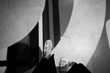 Asian woman walking down the decorated walk wayの写真素材