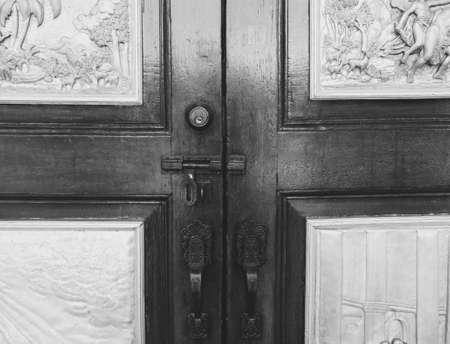 Chapel entrance lock and door knobs with engraved metalの写真素材