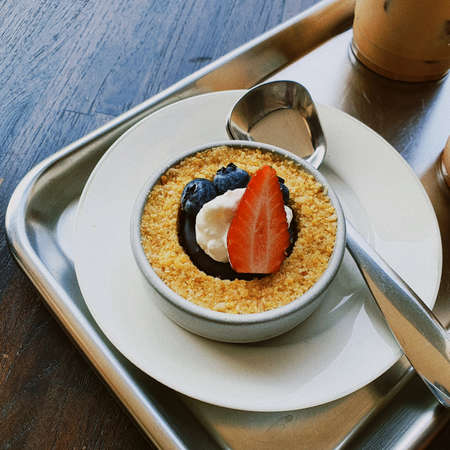 Classic berries tart served with coffee at lunch timeの写真素材