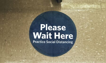 Social Distancing Sign On Supermarket Floorの写真素材