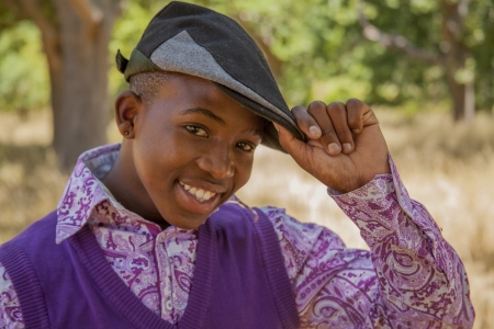 African teenage boy. outdoors with bright clothes