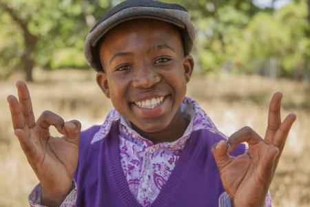 African teenage boy. outdoors with bright clothesの写真素材