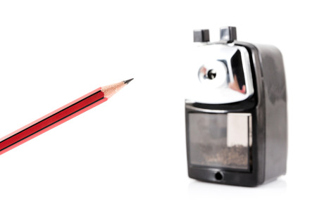 sharpener and colorful pencil isolated on white backgroundの写真素材