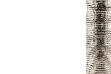 Stack of coins isolated on a white backgroundの写真素材
