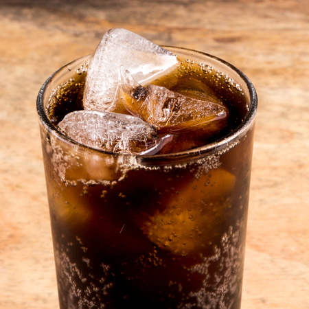 Cola in a glass with ice cubes.の写真素材