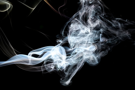 Abstract white smoke on black background.