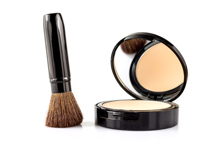 closeup of brush and face powder isolated on white.の写真素材