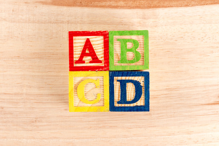 ABC wooden blocks on white background.