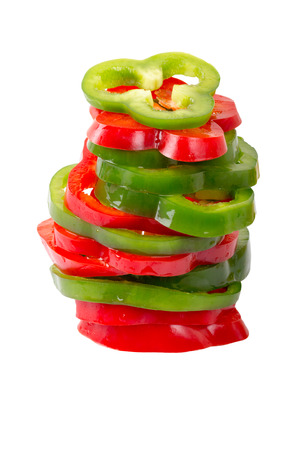 Slices of fresh colorful bell peppers isolated on white background with clipping path.の写真素材