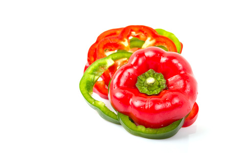 Slices of fresh colorful bell peppers isolated on white background.の写真素材