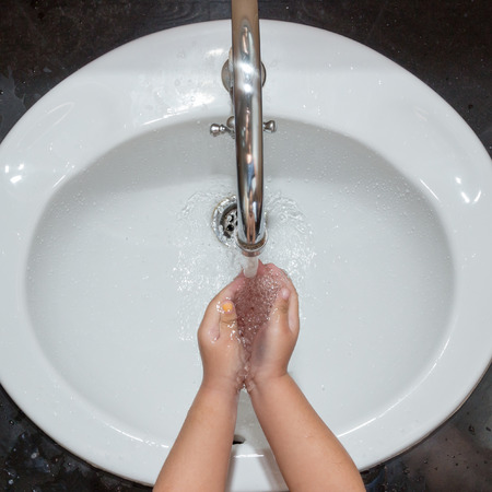 Washing kid hands,Hygiene. Cleaning Hands,Top view.の写真素材