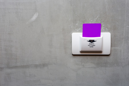 Purple  key card in electronic lock with copy space.の写真素材
