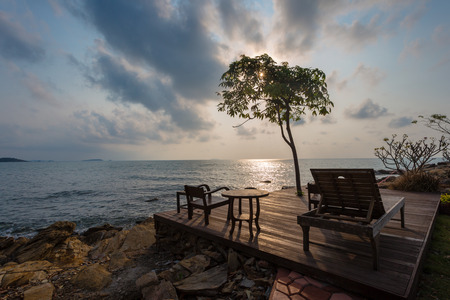 The chair was placed beside the seaside docks.の写真素材