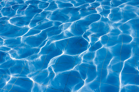 Surface of swimming pool water background.
