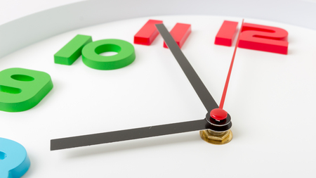 Colorful clock or time abstract background. white clock with red and black needles.の写真素材