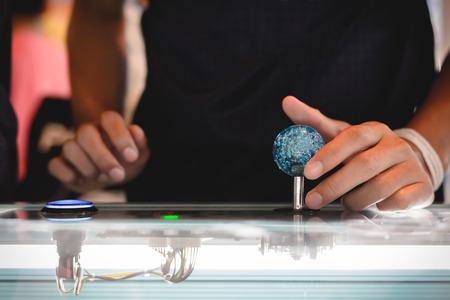 Close up hand control joystick of arcade.の写真素材