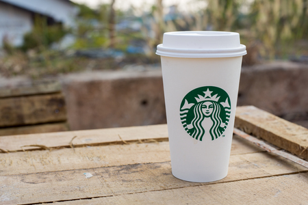 Bangkok, Thailand - Feb 22,2016 : Starbucks take away coffee cup with logo on sleeve, Starbucks brand is one of the most world famous coffeehouse chains from USAのeditorial素材