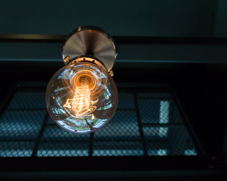Close up of Illuminated light bulb  with copy space.の写真素材
