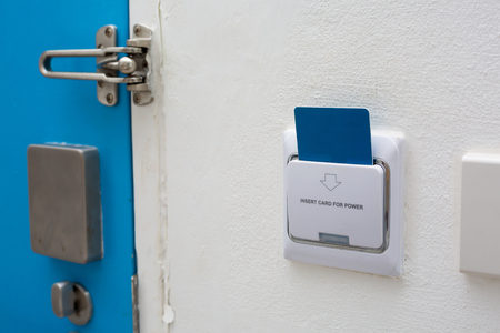 Blue key card in electronic lock with copy space