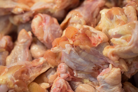 Close up of raw chicken wings in the market.の写真素材