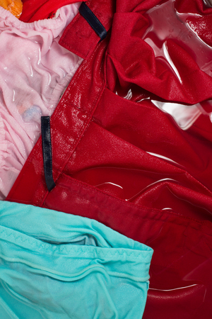 Color clothes that float above the water in the washing machine.の写真素材