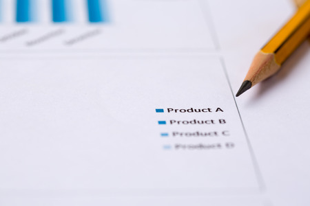 Financial accounting and marketing graphs analysis with a pencil.の写真素材