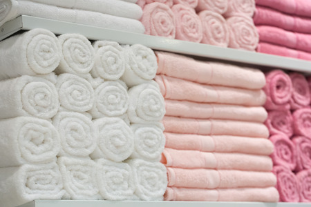 Towels in shelf store.Big shelf with a colorful stack towels.の写真素材