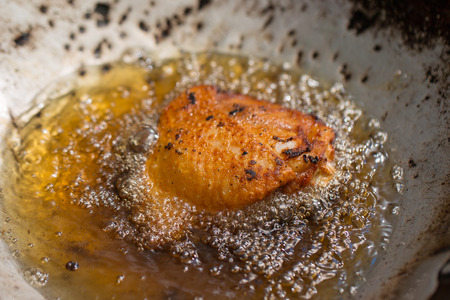 The chicken was fried in hot oil.の写真素材