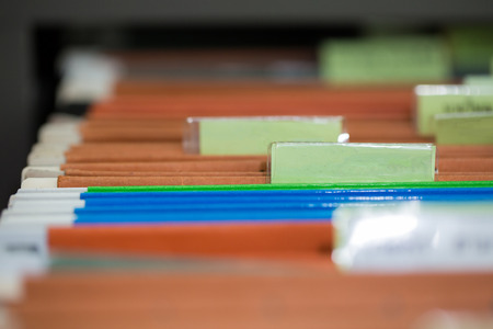 Close up of file folders with personal finance documents.
