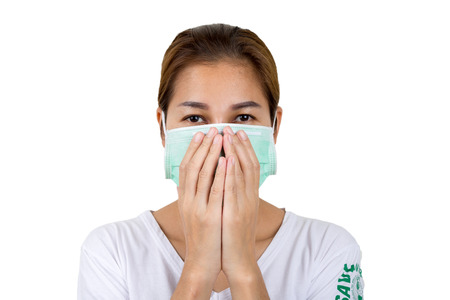 Closup of Asian woman using the medical face mask.の写真素材