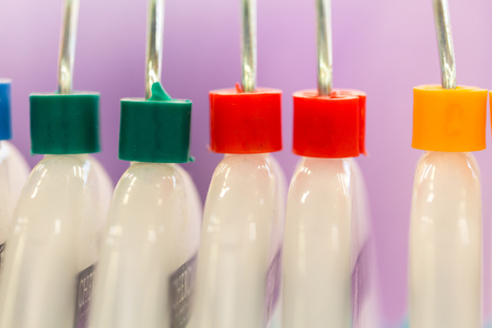 close up of clothes hanger with color sizing label.の写真素材