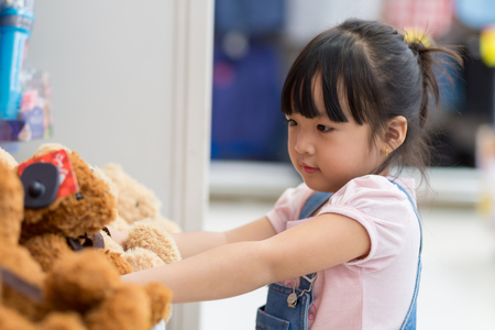 Asian girls shop for toys at department storesのeditorial素材