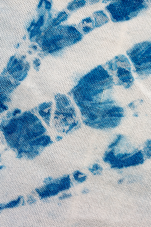 The fabric indigo tie dye as a background and texture