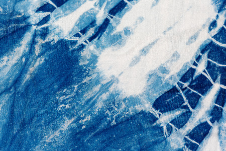 The fabric indigo tie dye as a background and textureの写真素材