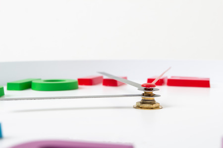 Colorful clock or time abstract background. white clock with red and black needles.の写真素材