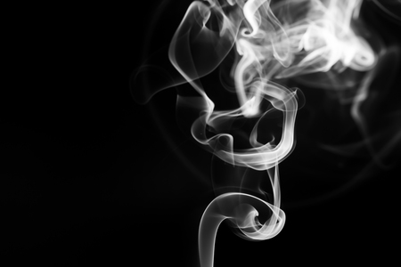 abstract Smoking white. Explosive powder white Smoke on black backgroundの写真素材