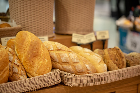 Variety of fresh bread in a supermarket.