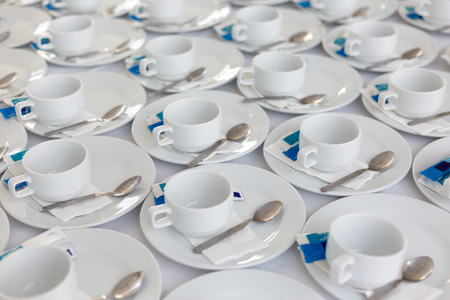 roup of empty Many rows of white ceramic coffee or tea cups.の写真素材