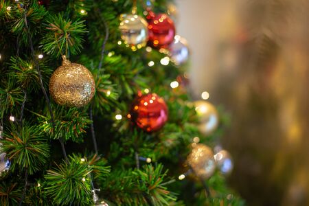 Colorful christmas Decoration with a candle on the wreathの写真素材