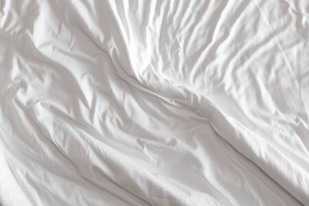 Wrinkled white blanket as a background.の写真素材