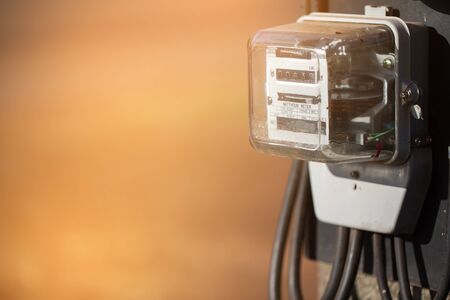 November 15th 2017 Udon Thani Thailand: electricity meter on electricity post in outdoor with blur nature background,The meter is a unit of power reading for Provincial Electricity Authority.の写真素材