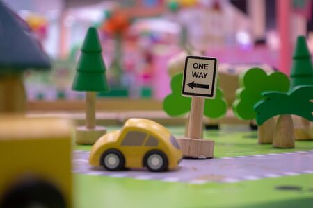 wooden toy car with one way sign.