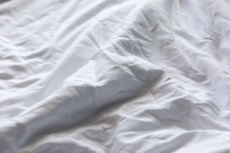 Wrinkled white blanket as a background.の写真素材